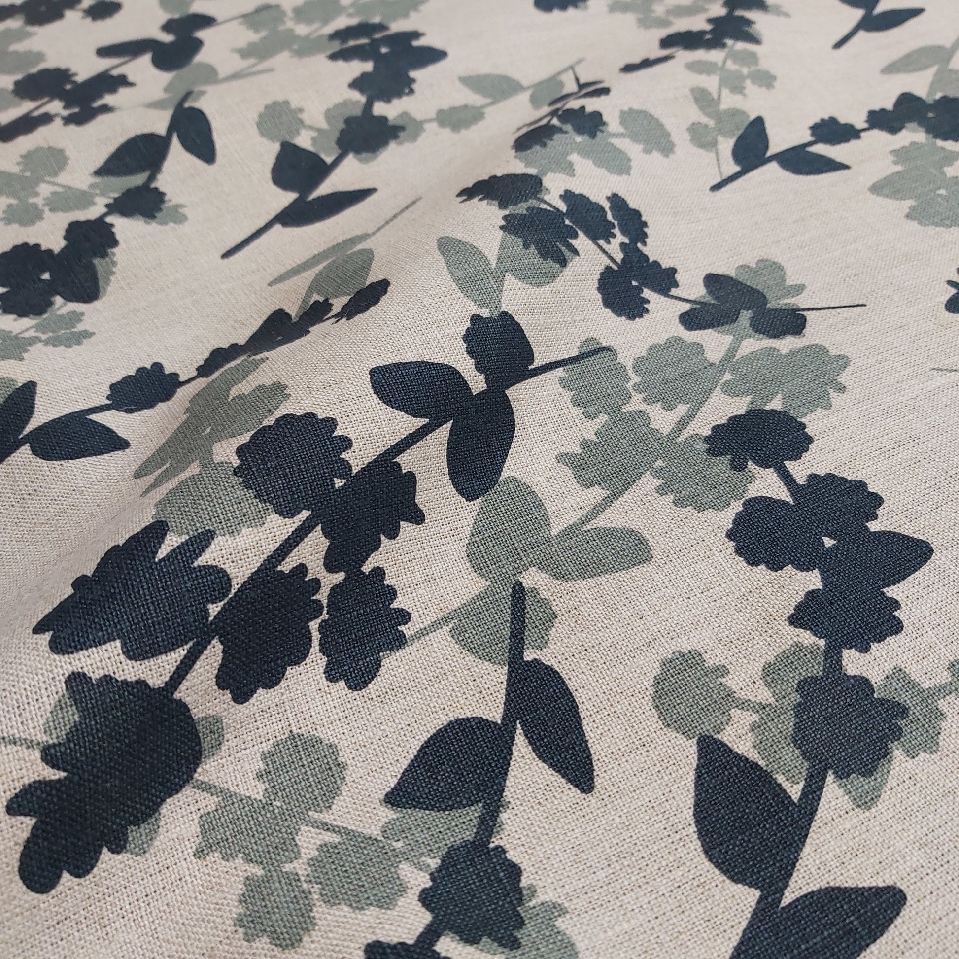 Hand screen printed linen featuring wattle sprigs pattern in storm and indigo. Printed and designed by Femke Textiles
