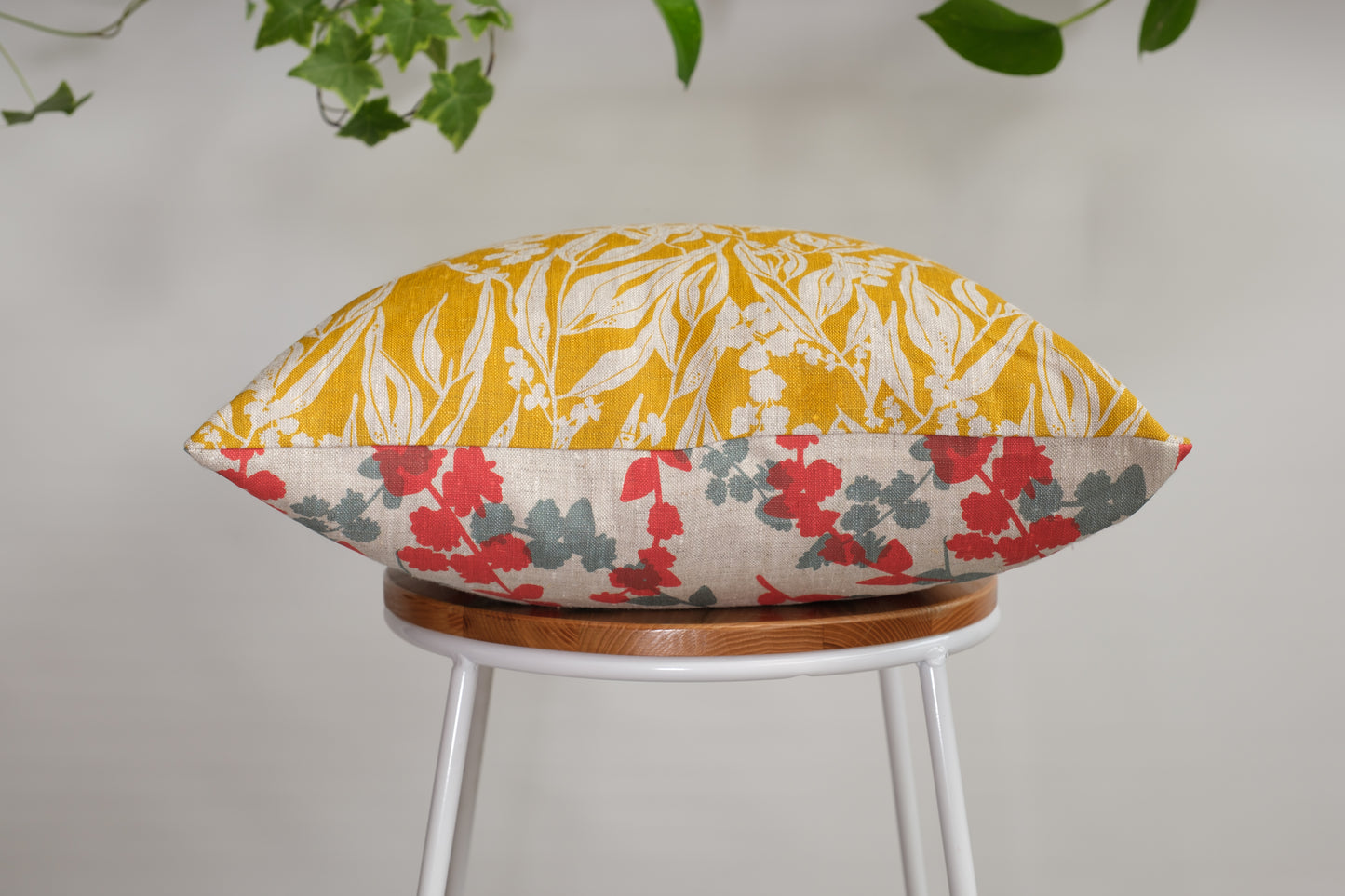 Linen cushion cover featuring hand screen printed wattle sprigs and nuts about wattle. Designed and made by Femke Textiles