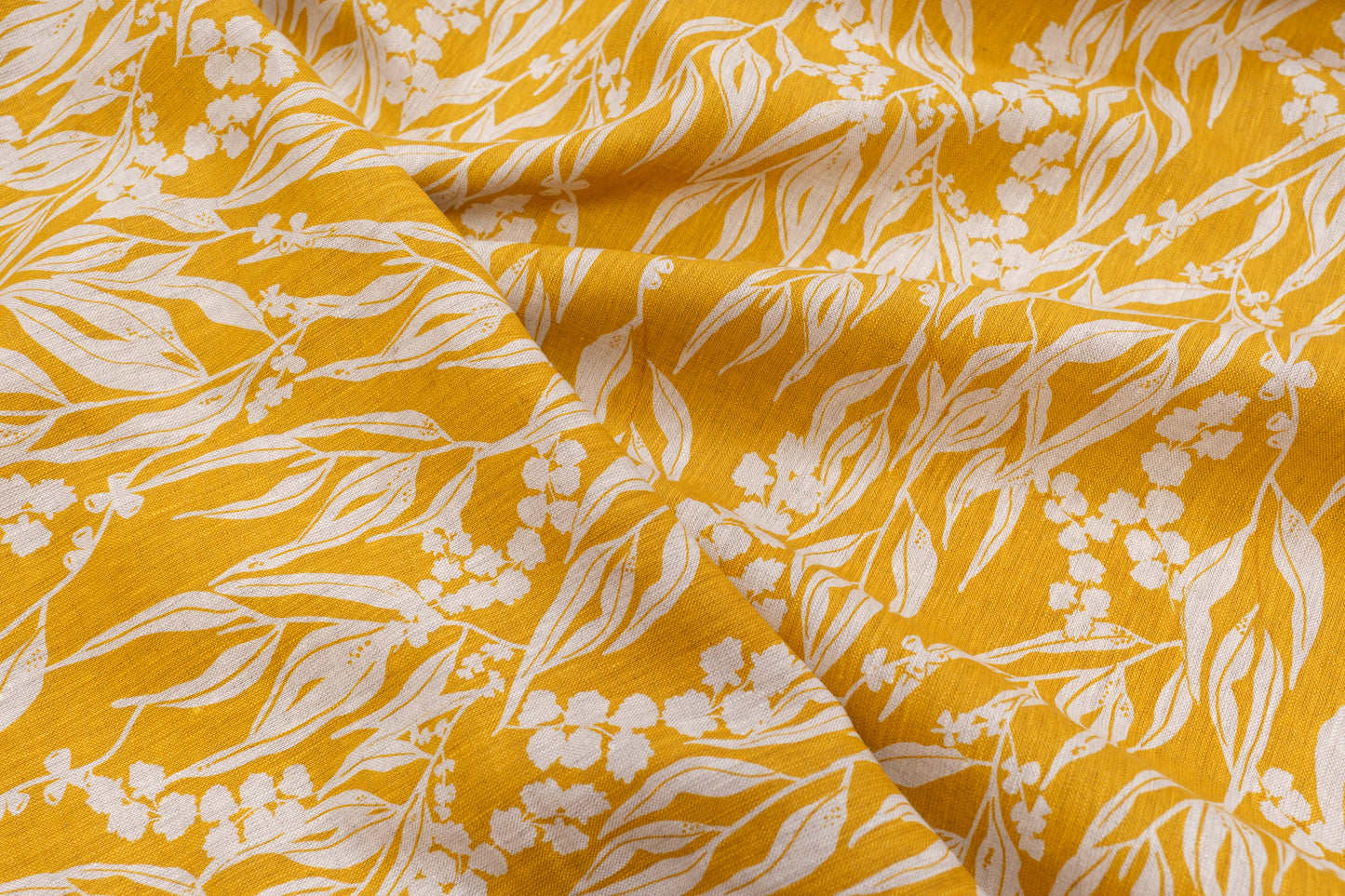 Screenprinted linen fabric by Femke Textiles featuring Nuts about Wattle in Mustard on an oatmeal linen.