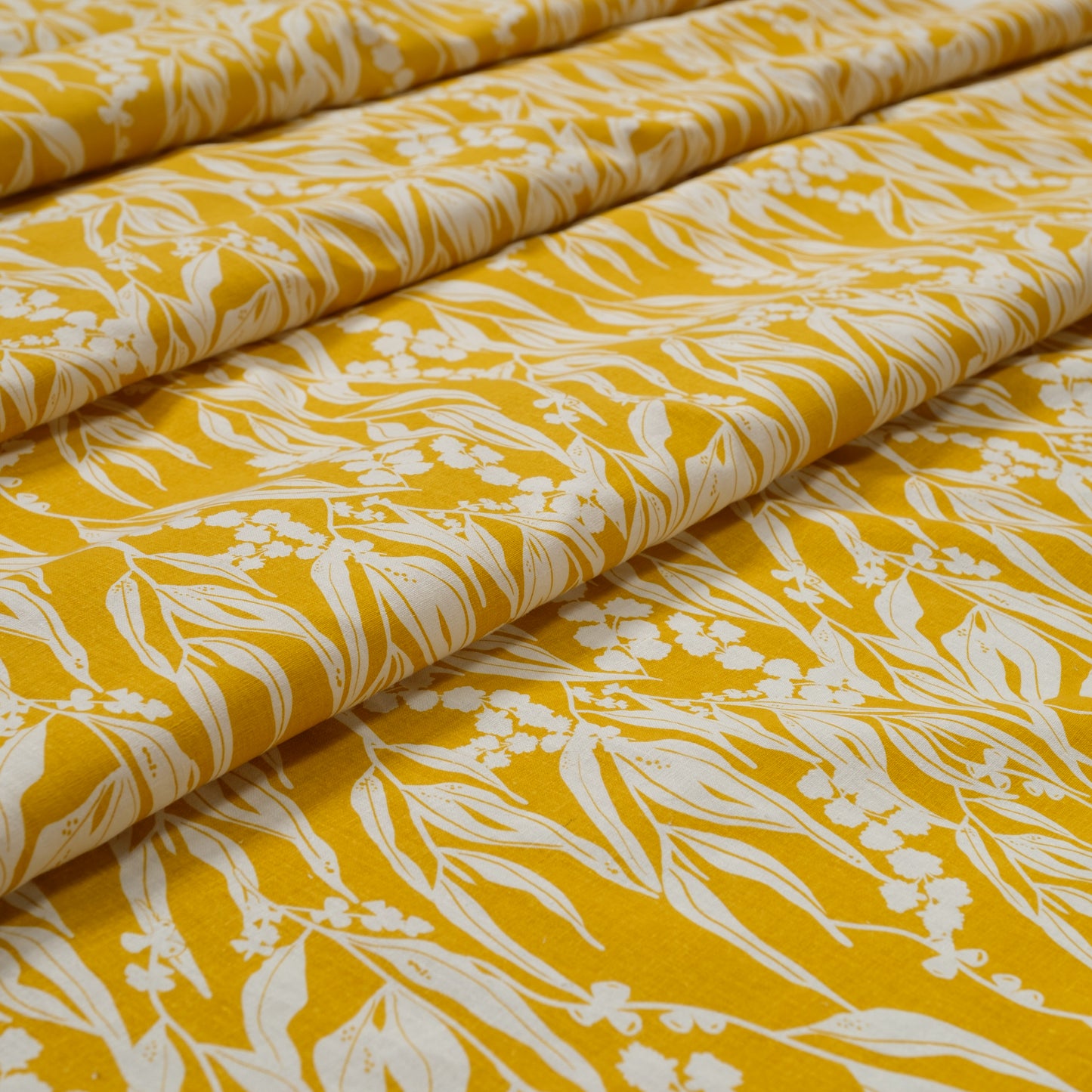 Organic cotton and hemp fabric screenprinted with pattern Nuts about Wattle in the colour Mustard. Designed and screenprinted in Melbourne by Femke Textiles.