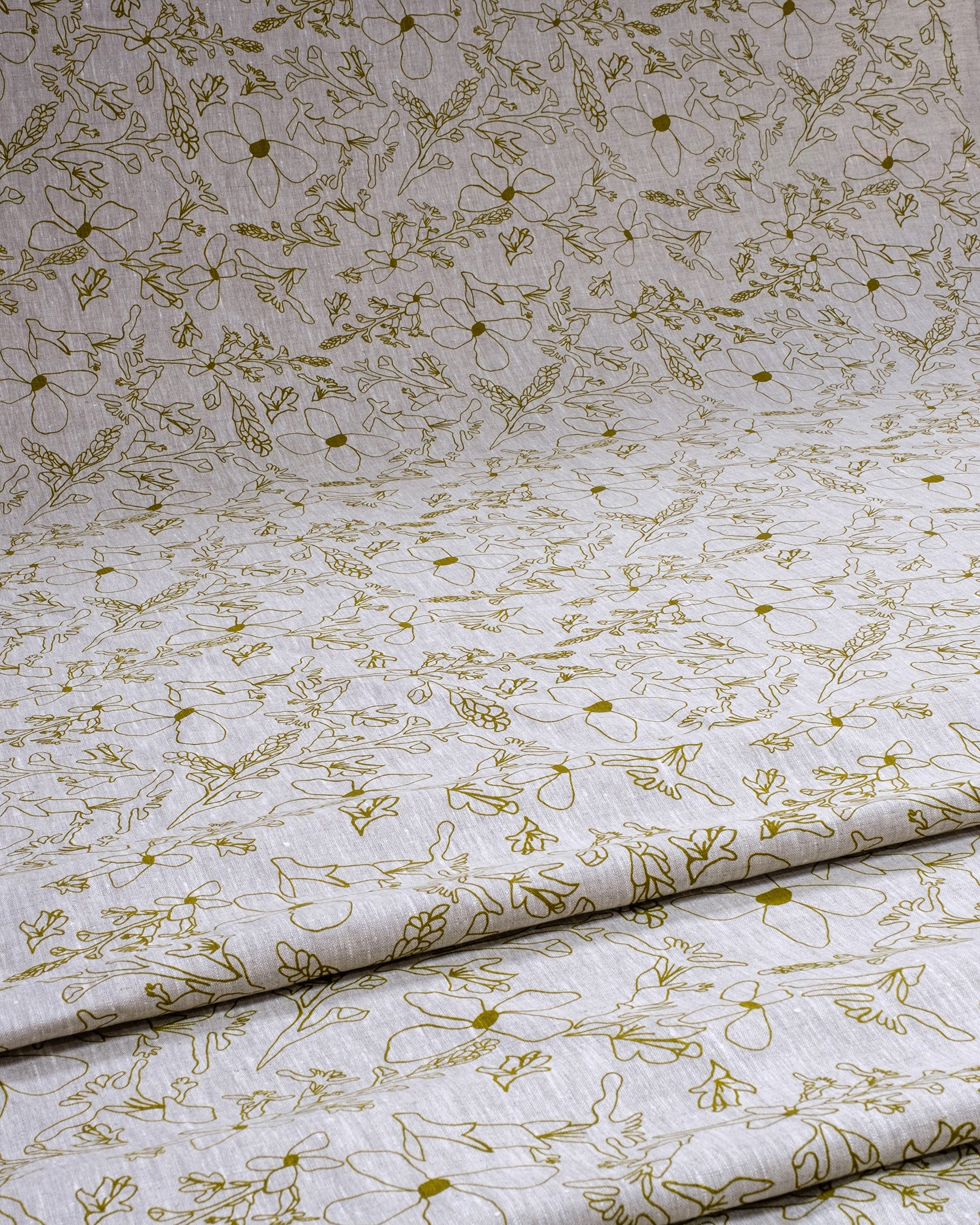 Linen fabric screenprinted with grass trigger pattern in olive oil. Designed and printed by Femke Textiles in Melbourne Australia