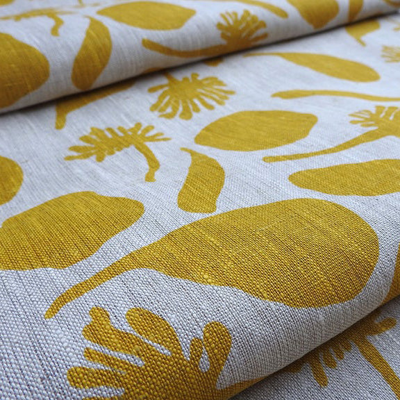 Linen fabric hand screen printed with seedpods design in a mustard colour. Printed and designed by Femke Textiles. Base cloth oatmeal linen.