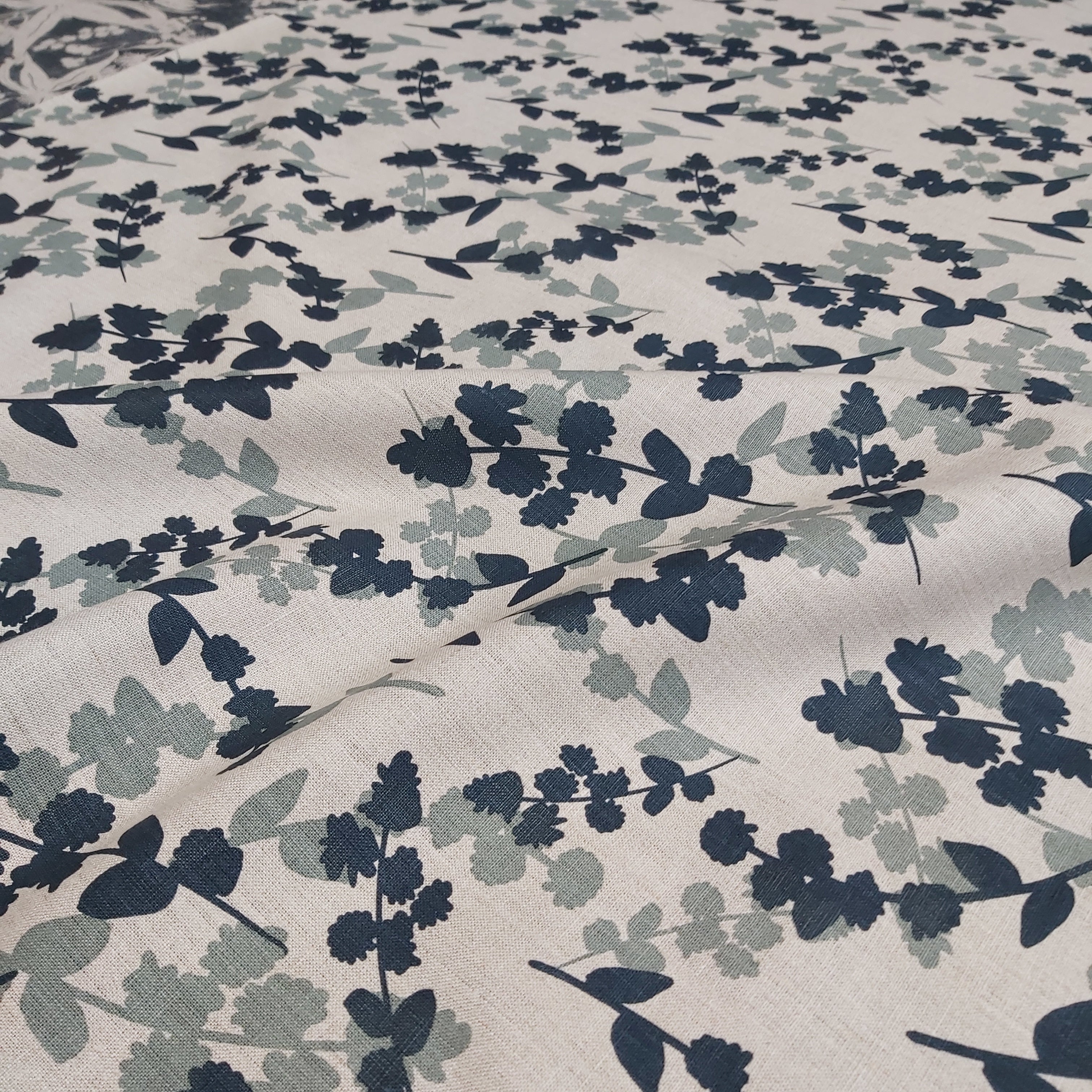 Hand screen printed linen featuring wattle sprigs pattern in storm and indigo. Printed and designed by Femke Textiles