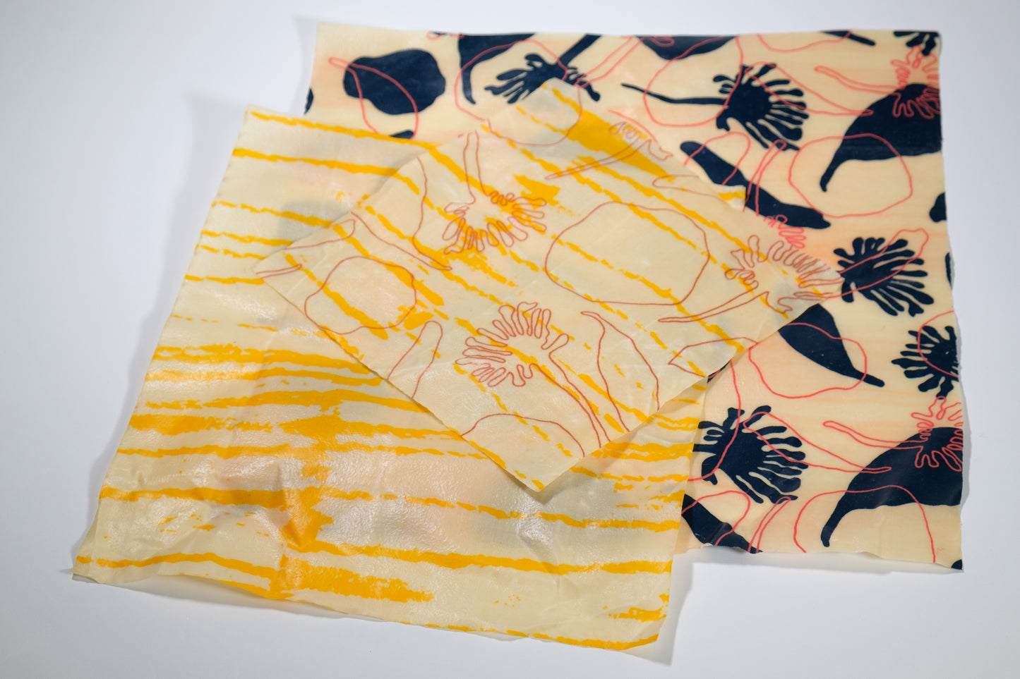 Collection of beeswax wraps. Large, medium and small. Femke Textiles screenprinted fabric.