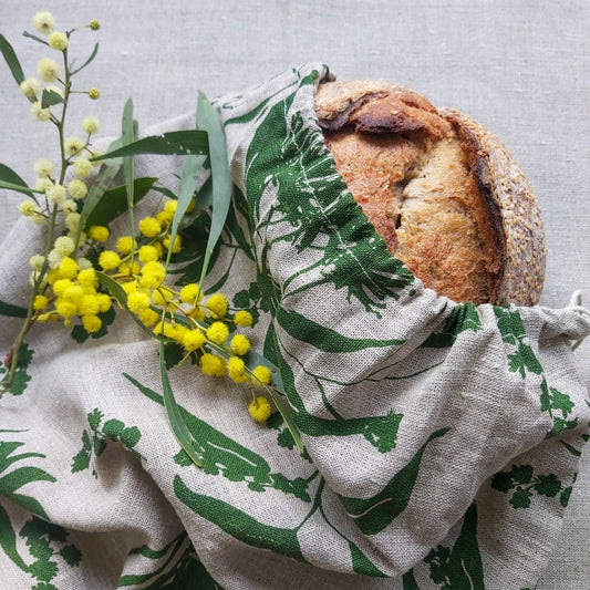 A linen breadbag screenprinted with local forage pattern in envy on flax linen. Designed and printed by Femke Textiles.