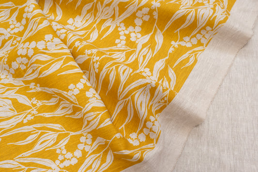 Screenprinted linen fabric by Femke Textiles featuring Nuts about Wattle in Mustard on an oatmeal linen.