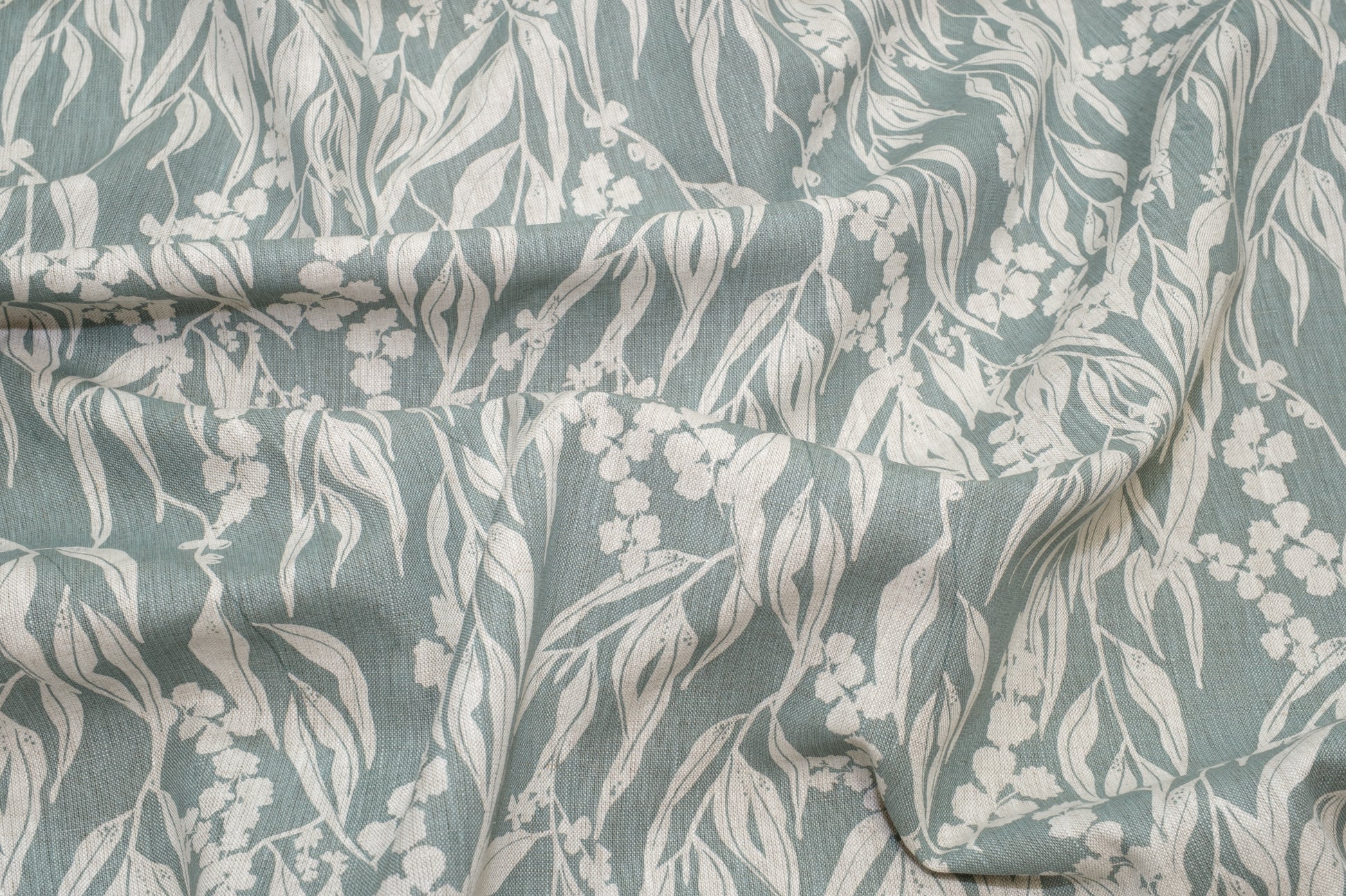 Screenprinted linen fabric by Femke Textiles featuring Nuts about Wattle in Storm on an oatmeal linen.