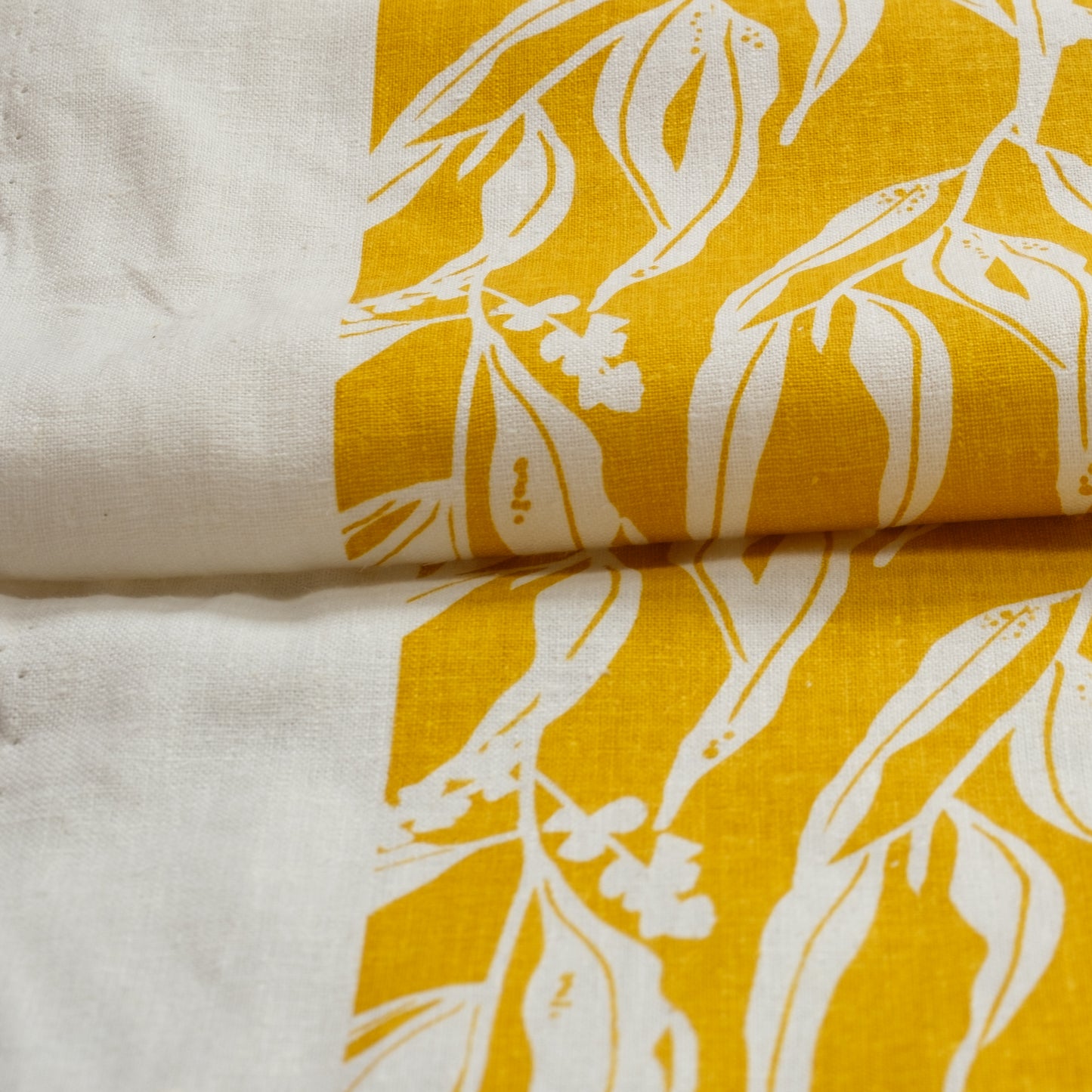 Organic cotton and hemp fabric screenprinted with pattern Nuts about Wattle in the colour Mustard. Designed and screenprinted in Melbourne by Femke Textiles.