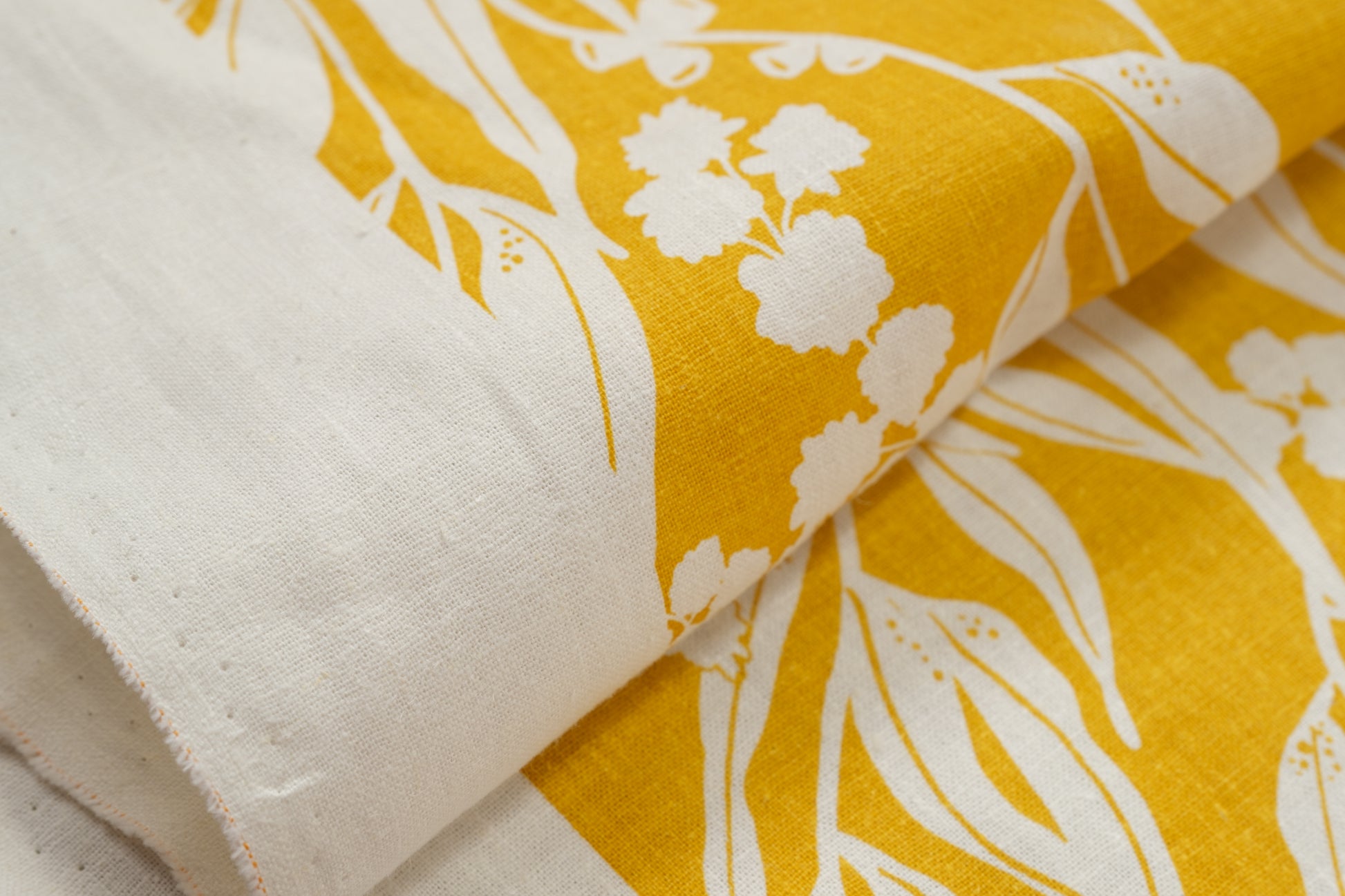 Organic cotton and hemp fabric screenprinted with pattern Nuts about Wattle in the colour Mustard. Designed and screenprinted in Melbourne by Femke Textiles.