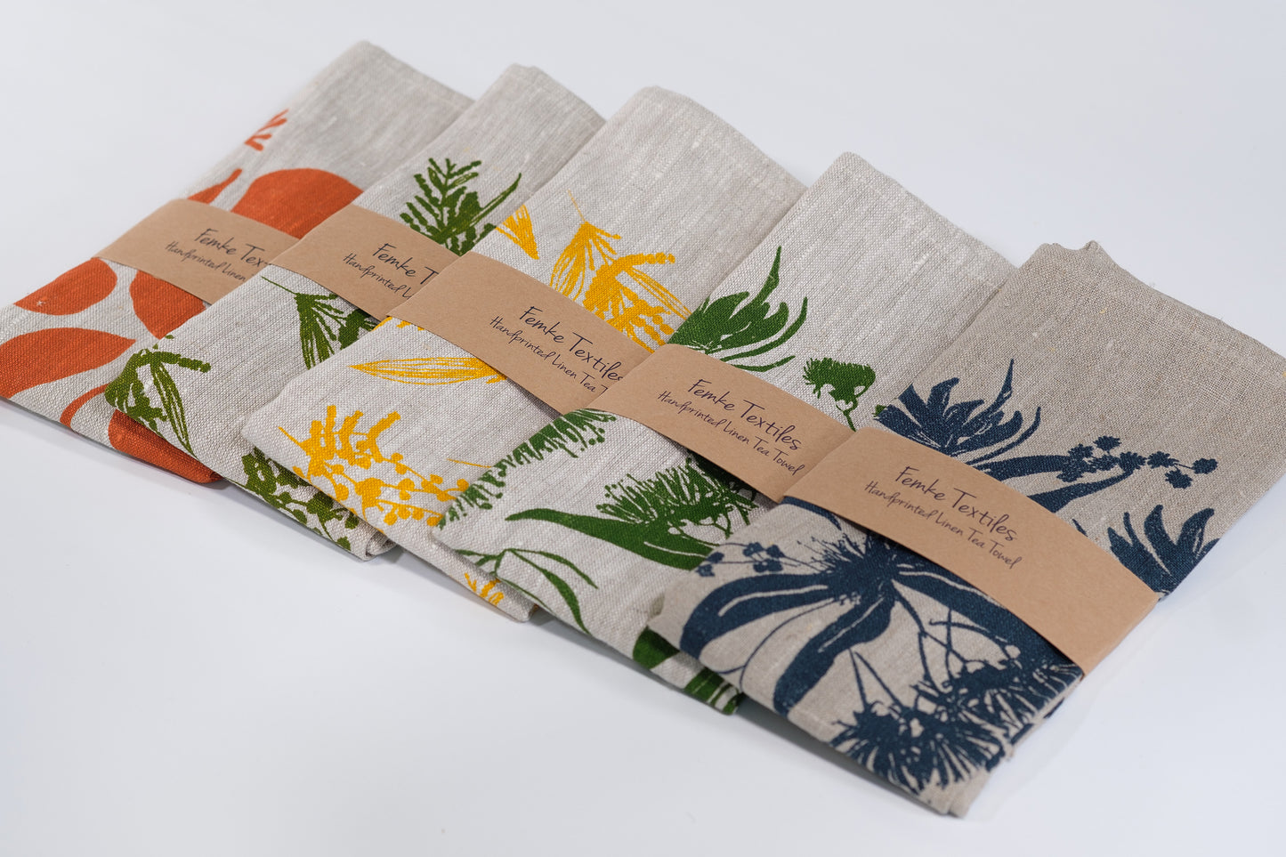 Linen tea towels featuring seedpods, wattle and local forage designs. Screen printed and designed by Femke Textiles