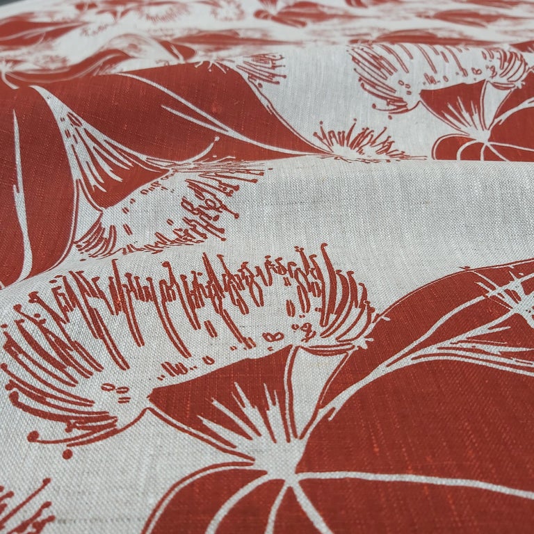 Image of hand screenprinted oatmeal linen with flying gumnut design in redwood. Designed and printed by Femke Textiles.