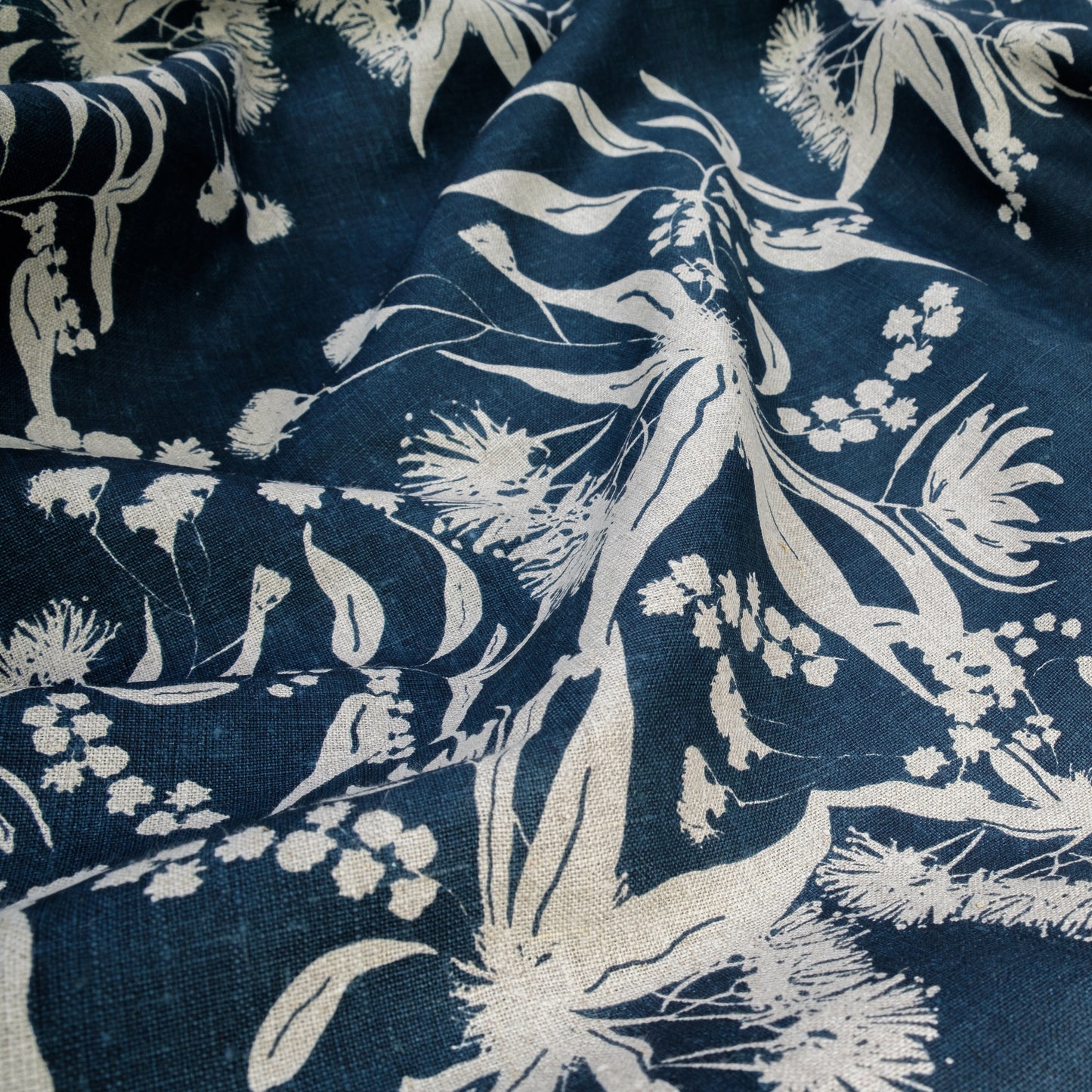 Forager's delight pattern in indigo screenprinted on flax linen.  Designed and screenprinted by Femke Textiles in Melbourne Australia.