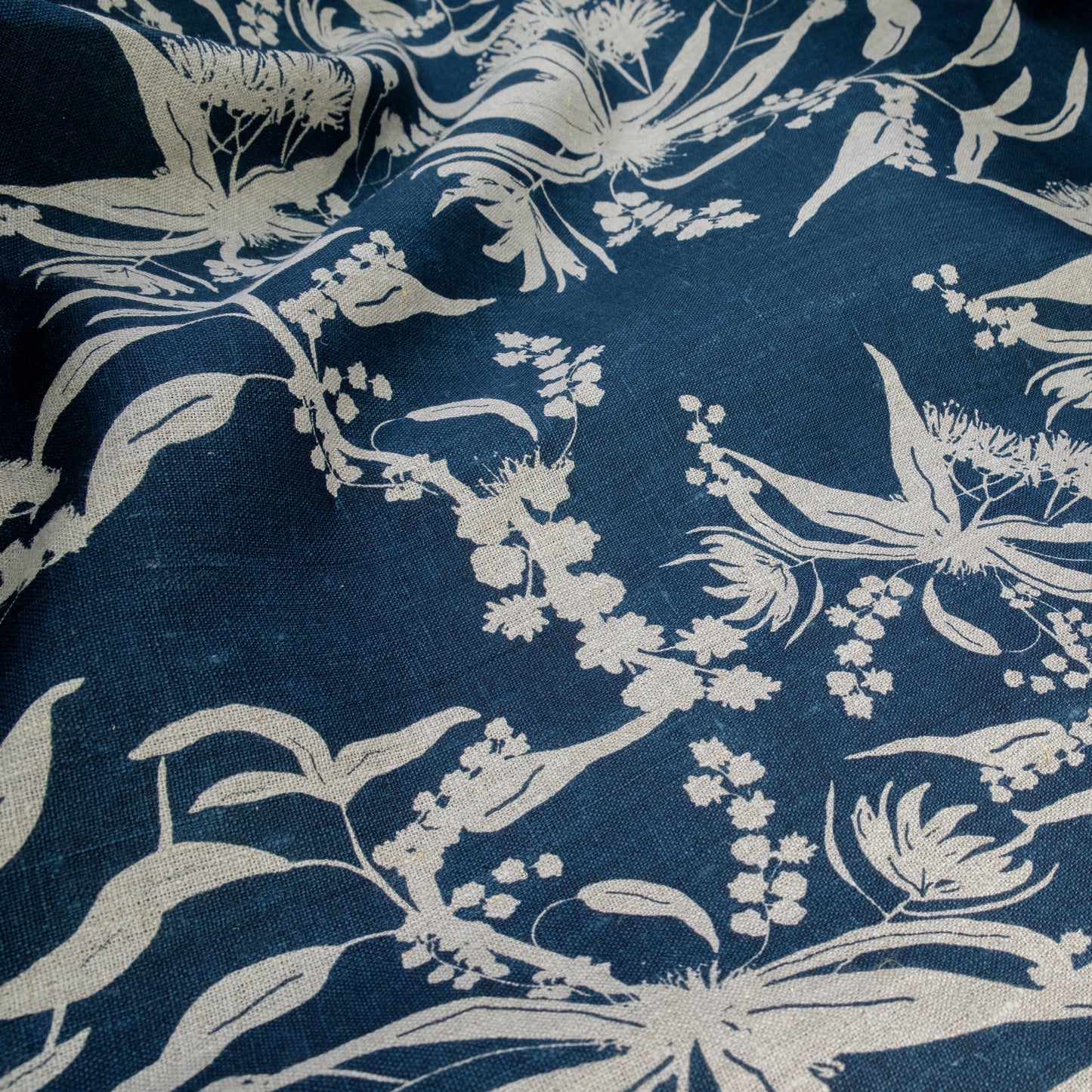 Forager's delight pattern in indigo screenprinted on flax linen. Designed and screenprinted by Femke Textiles in Melbourne Australia.
