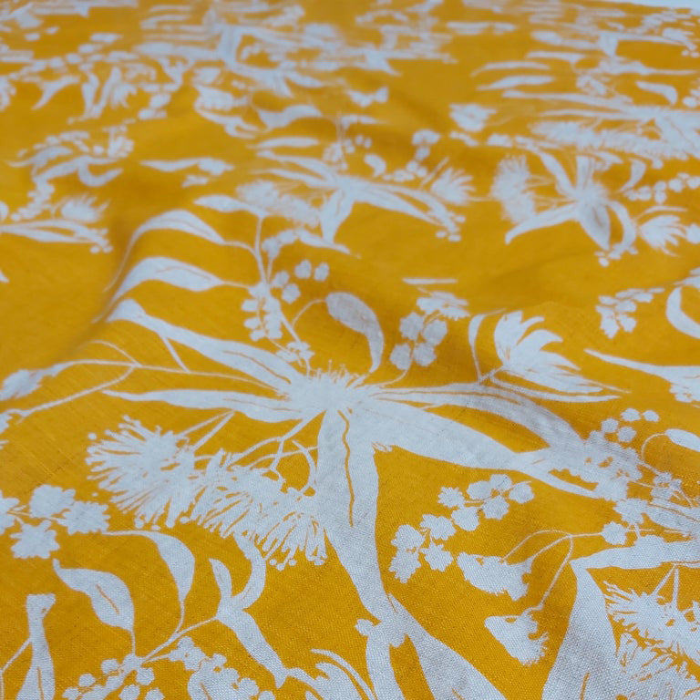 Screen printed linen featuring Forager's Delight pattern in wattle yellow. Screenprinted and designed by Femke Textiles in Melbourne Australia.