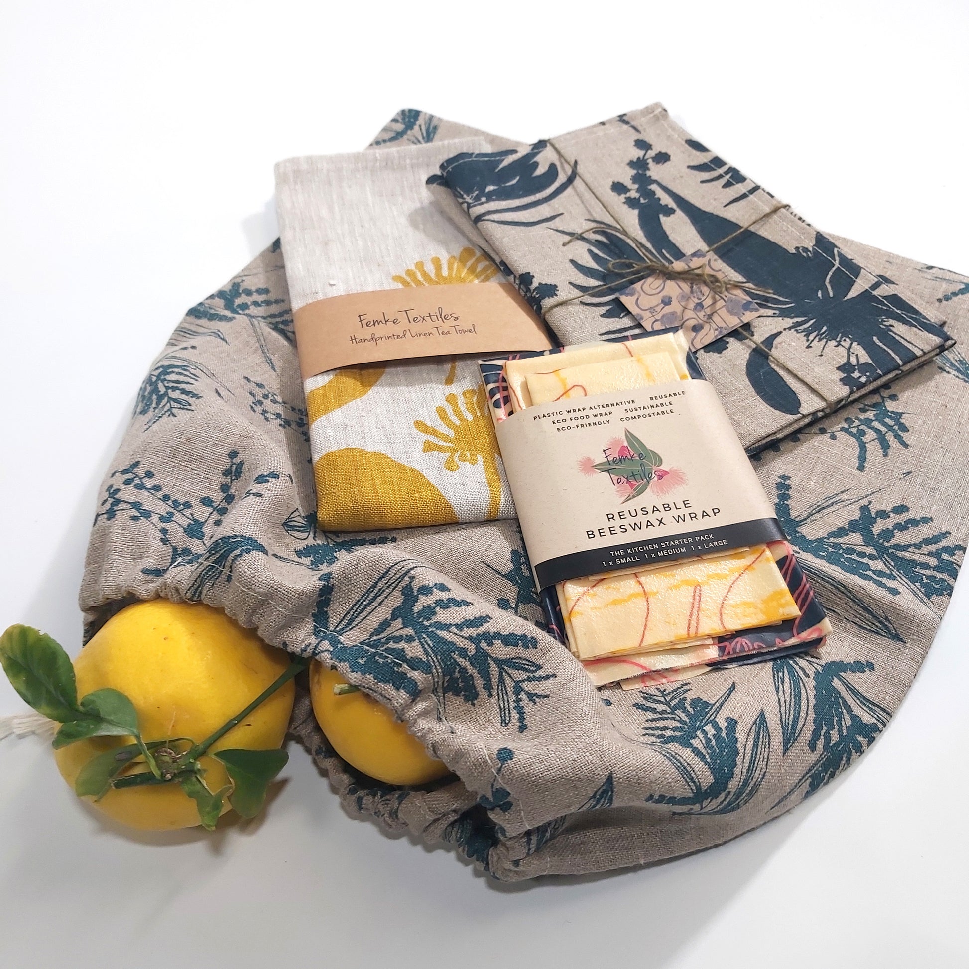 Kitchen starter pack featuring a tea towel, bread bag, set of napkins and beeswax wraps. Fabric screenprinted by Femke Textiles.