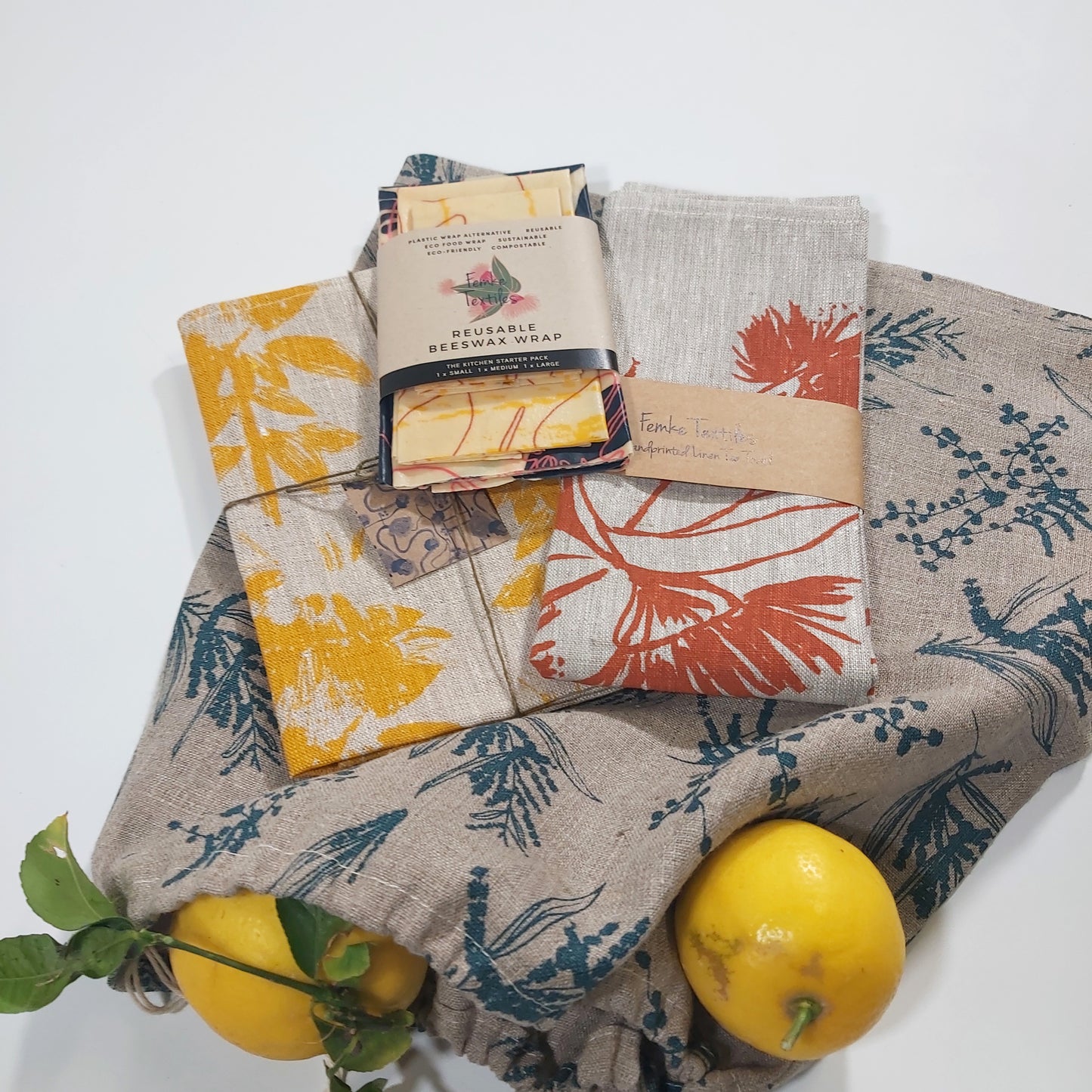 Kitchen starter pack featuring a tea towel, bread bag, set of napkins and beeswax wraps. Fabric screenprinted by Femke Textiles.