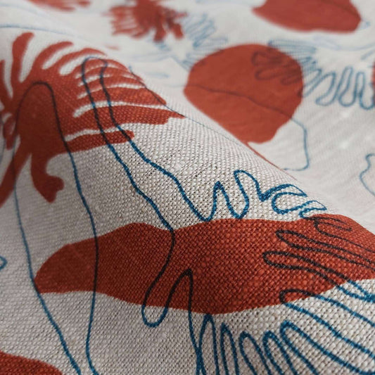 Linen oatmeal fabric screenprinted with seedpods design in redwood and sea blue. Printed and designed in Melbourne by textile designer Femke Textiles.
