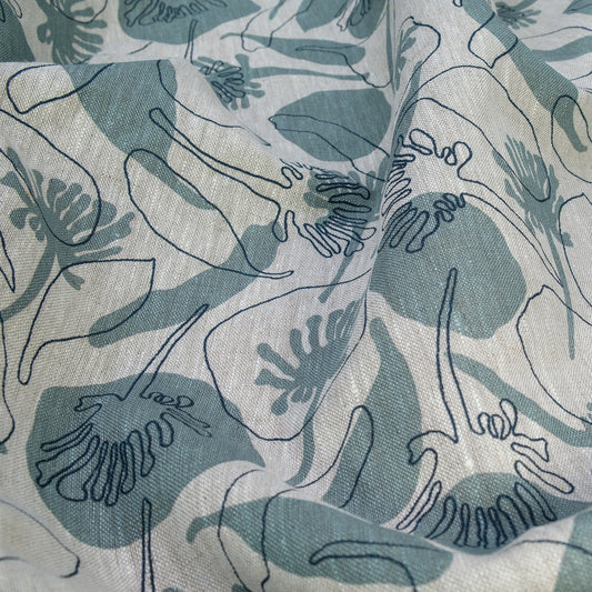Linen fabric hand screenprinted with seedpods design in storm and indigo colour. Designed and printed by Femke Textiles. Basecloth is an oatmeal linen.